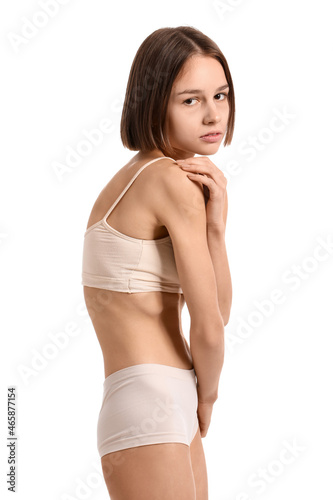 Young skinny woman on white...