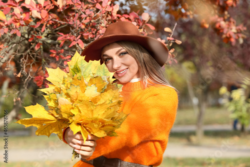 Happy woman with bouquet of...