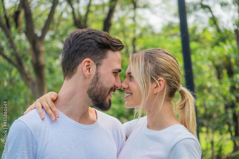 caucasian couple having romanatic moment together in park caucasian couple having romanatic moment together in park