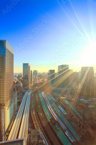 東京駅と電車と丸の内の都心のビル群,夕景, 千代田区,東京都