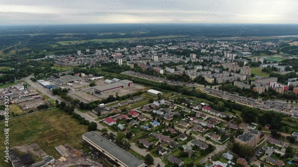 Private houses and block apartment building in distance, aerial drone view Private houses and block apartment building in distance, aerial drone view