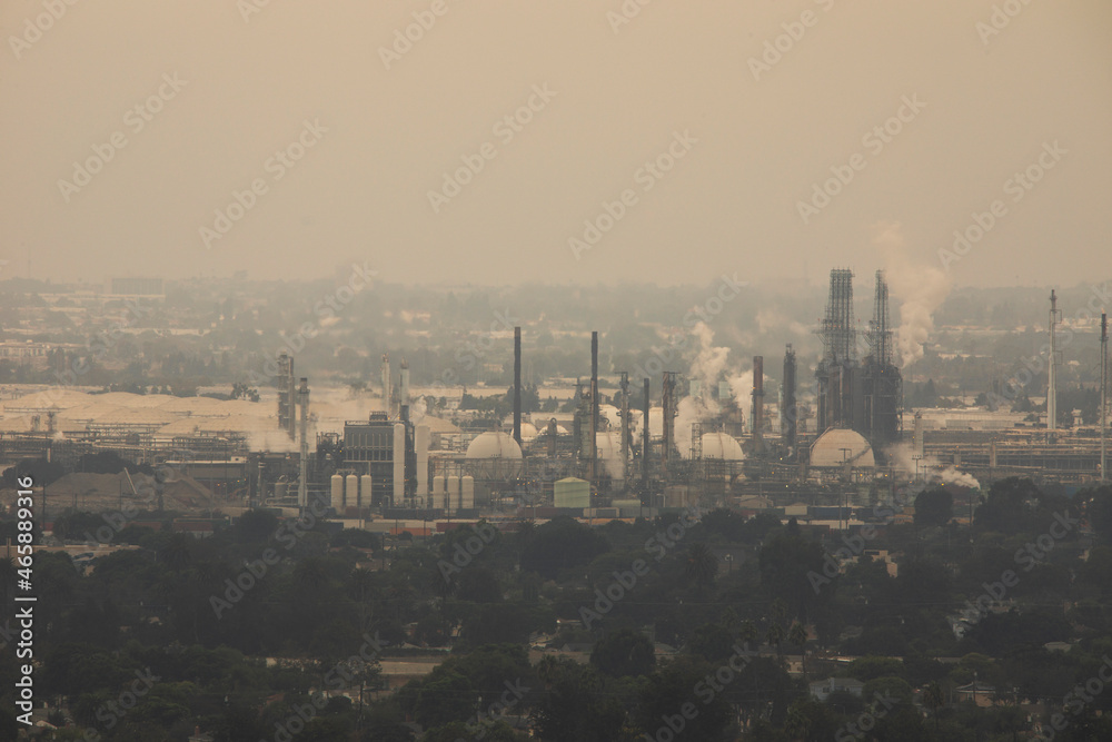 Global warming emissions from oil refining pollute the sky with C02. Global warming emissions from oil refining pollute the sky with C02.