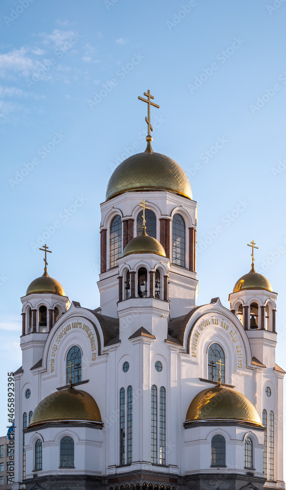 The golden domes of the Christian church in sunset light.