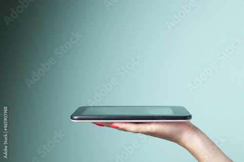 woman holding tablet as a stand