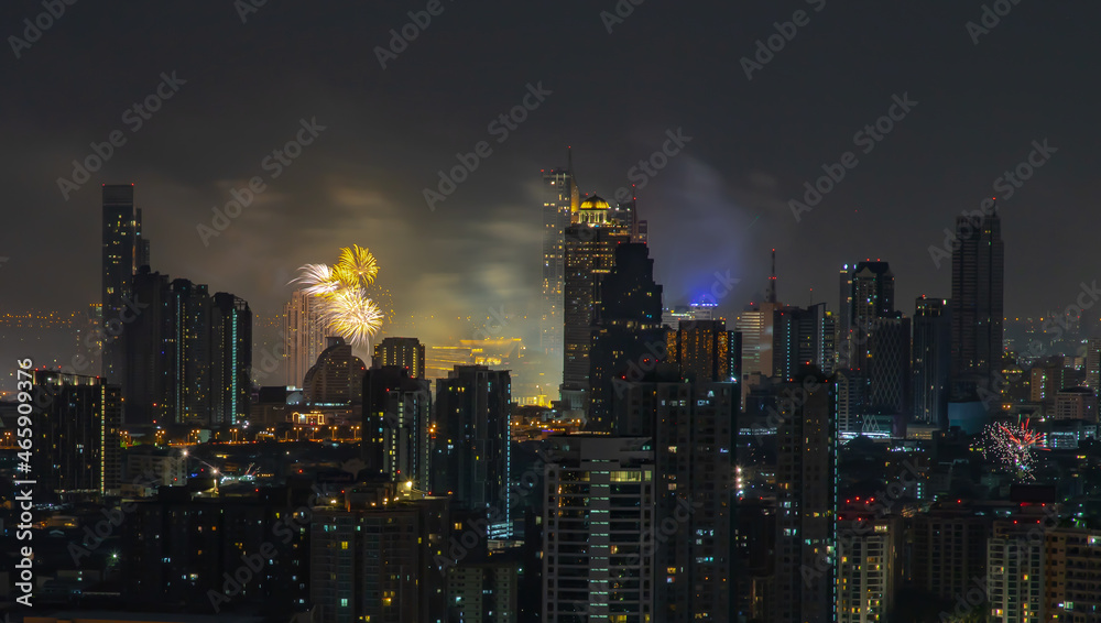 Colorful Firework with cityscape night light view of Bangkok skyline at twilight time. New Year celebration fireworks, Bangkok city,Thailand Fireworks light up to sky at Christmas & New Year festival 