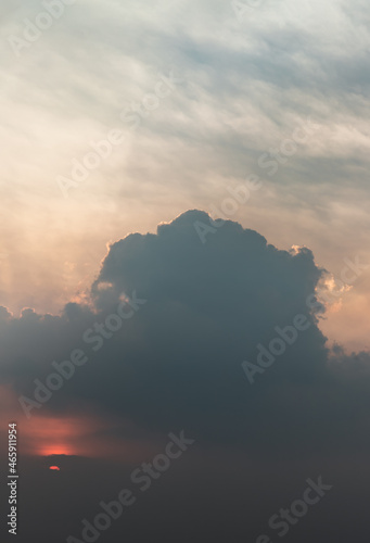 Beautiful sunset sky above clouds with dramatic light, Beautiful blazing sunset landscape, Horizon. Warm Colours, copy space, No focus, specifically. © num