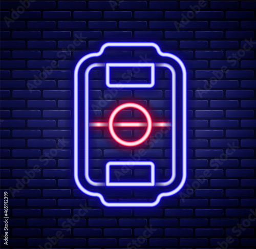 Glowing neon line Table football game hobby or leisure icon isolated on brick wall background. Sport team football players. Colorful outline concept. Vector