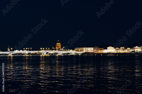 RUSSIA, Saint Petersburg: Scenic sunset cityscape view of the city architecture with Neva river bridges. Evening twightlight St. Isaac's Cathedral architecture  photo