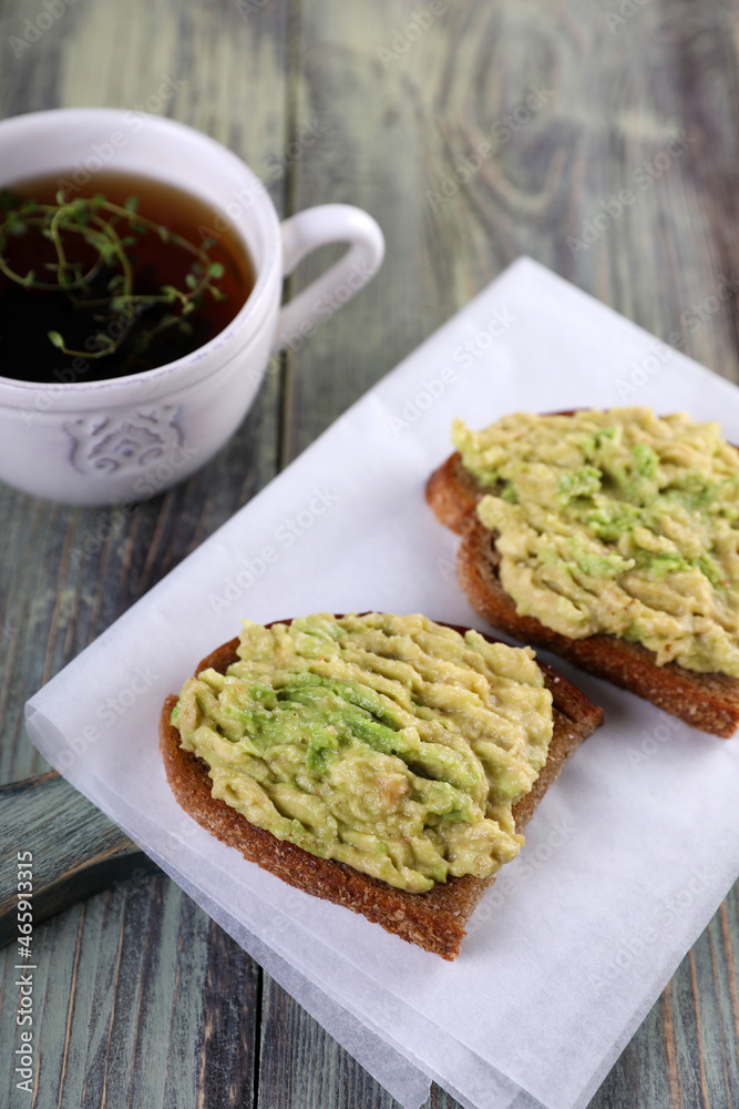 Two avocado toast and lemon thyme tea