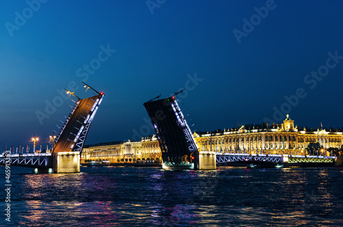 RUSSIA, Saint Petersburg: Scenic sunset cityscape view of the city architecture with Neva river bridges. Evening twightlight St. Isaac's Cathedral architecture  photo