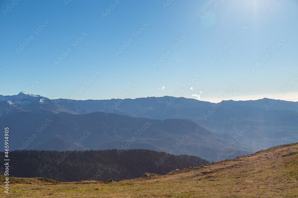 Beautiful panorama of the Caucasus mountains on a sunny autumn day