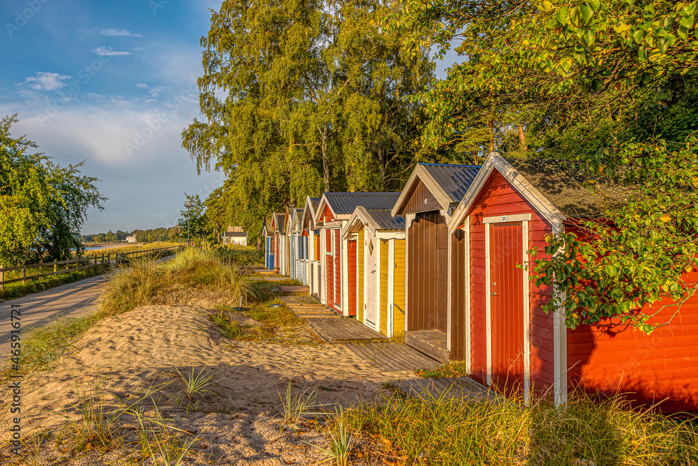 coloured beach huts in a row