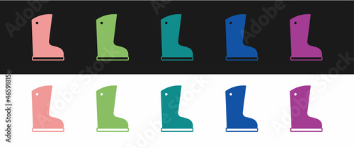 Set Waterproof rubber boot icon isolated on black and white background. Gumboots for rainy weather, fishing, gardening. Vector