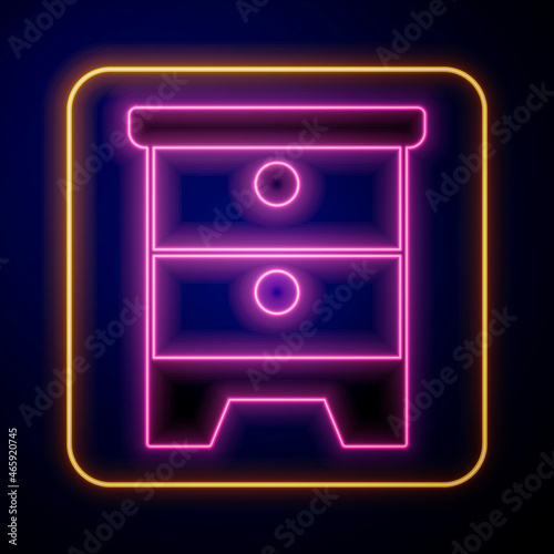 Glowing neon Furniture nightstand icon isolated on black background. Vector