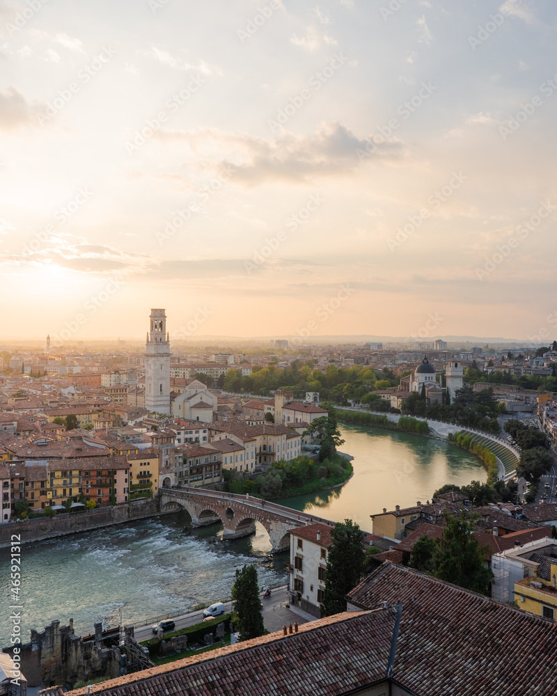 Adige river and Ponte Pietra in Verona city at sunset.