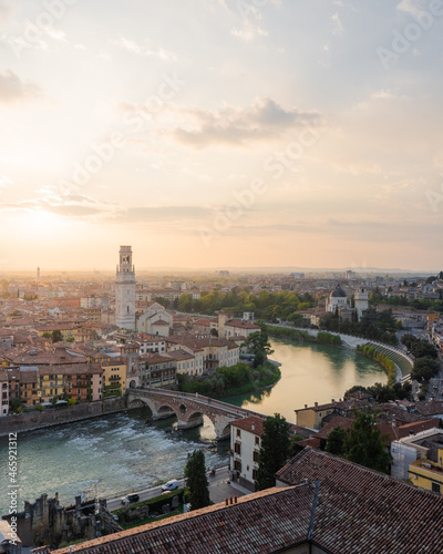 Adige river and Ponte Pietra in Verona city at sunset.