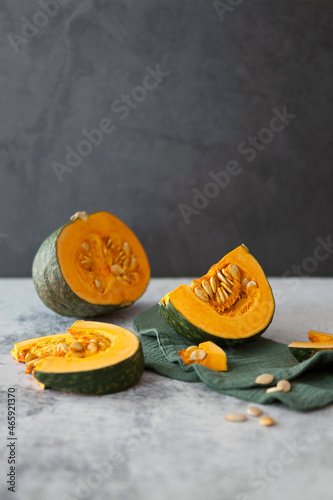 Orange ripe pumpkin and slices
