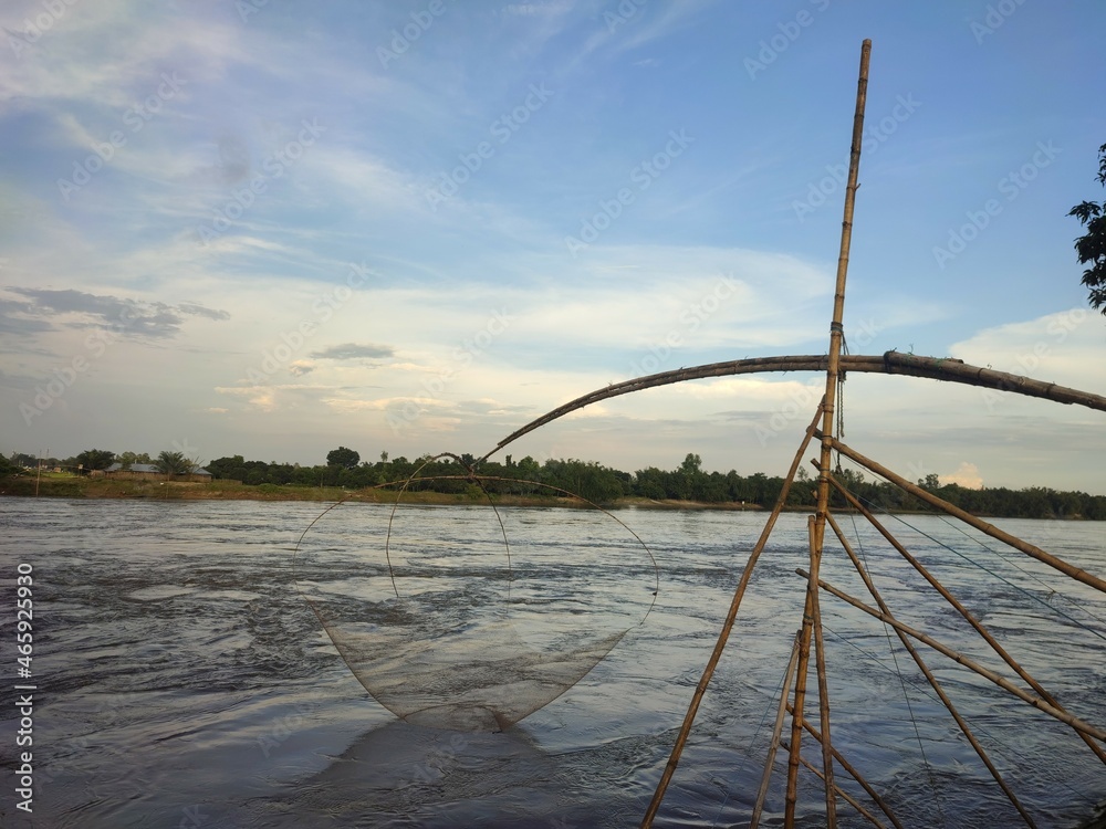Fototapeta premium Indian fishing technique with bamboo structure in the river.