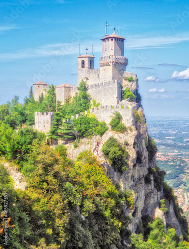 San Marino castle on a cliff during the day, sunny