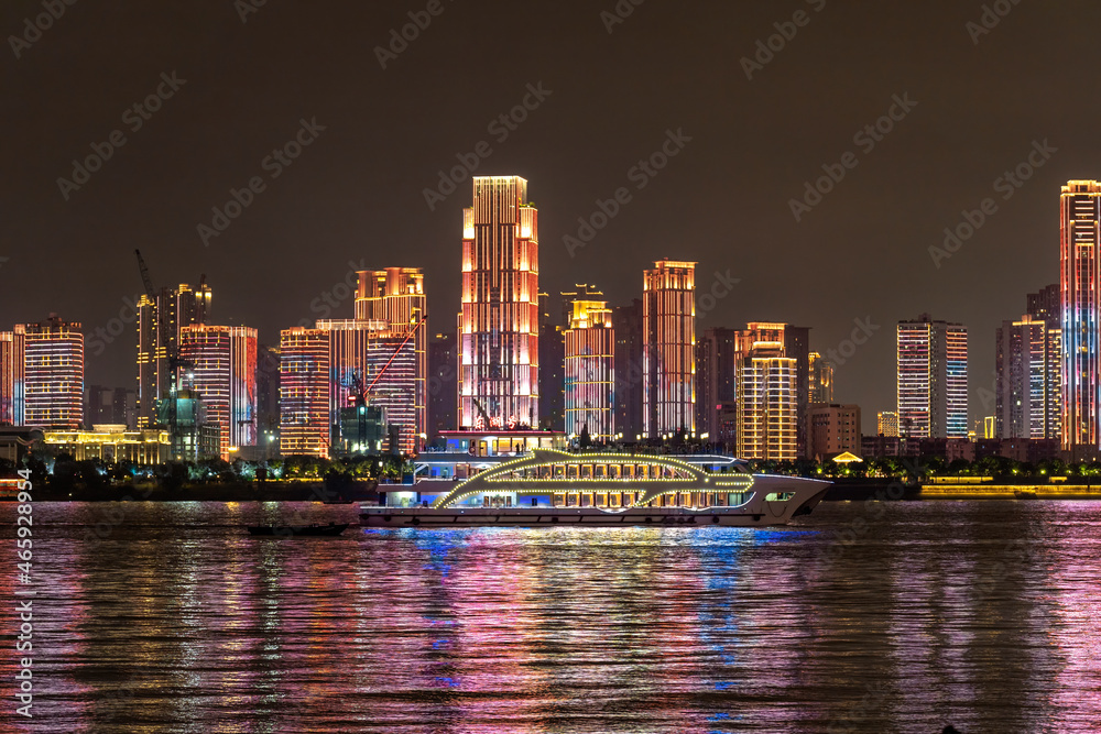 Obraz premium Skyscrapers panorama from shoreside of Yangtze river Wuhan, night view
