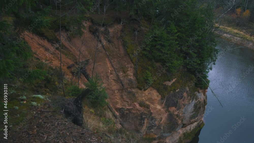 Erglu Cliffs and Great View on the Gauja River Cesis, Latvia. Autumn Landscape Red Rocks Stone Cliff and River at Gauja National Park. Stedicam Dolly Shot 4K. Erglu Cliffs and Great View on the Gauja River Cesis, Latvia. Autumn Landscape Red Rocks Stone Cliff and River at Gauja National Park. Stedicam Dolly Shot 4K.