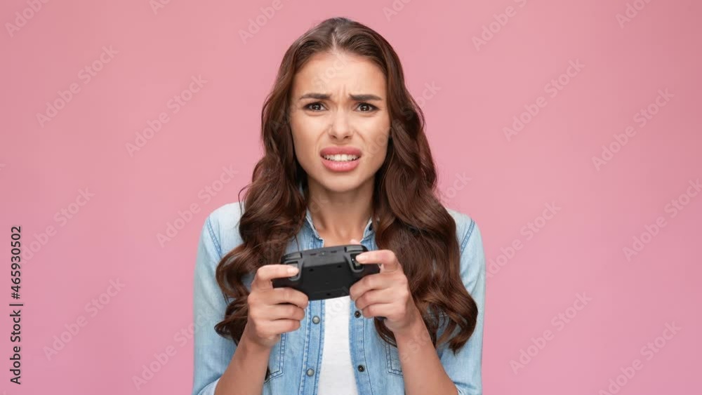 Funny charming girl hold gamepad play videogame unexpected lose Funny charming girl hold gamepad play videogame unexpected lose