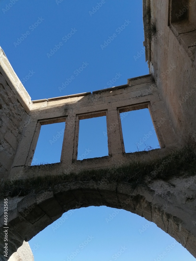 Fototapeta premium old archway with three windows in colour