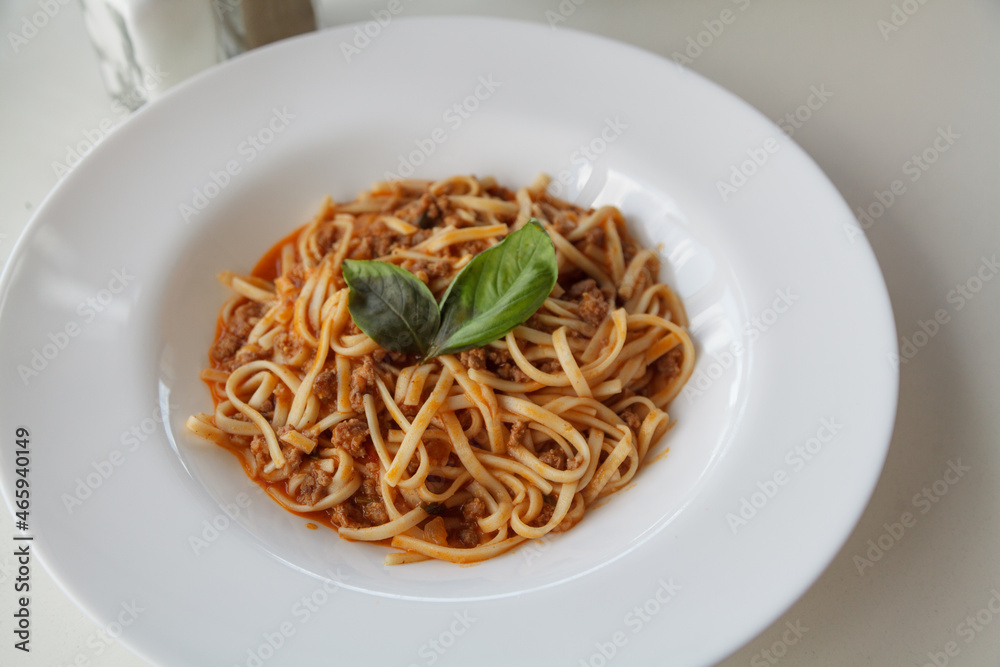 Dish of pasta on round white plate