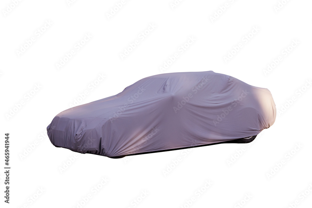 The passenger car is covered with a grey protective awning on a white background. Insulated object. Protects the vehicle's paintwork. Protects the vehicle from the sun and natural precipitation