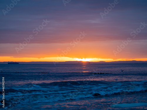 Picturesque seascape during sunset  Golden shining reflection of sunlight on the sea.