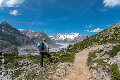 Hiker near Riederalp with Aletsch Glacier
