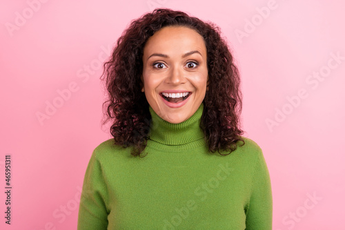 Photo of beautiful impressed african lady dressed green turtleneck smiling open mouth isolated pink color background