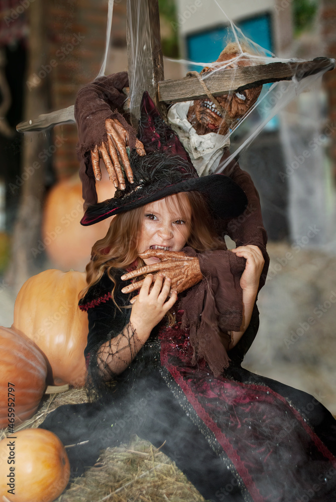 witch girl holiday Halloween depicts the bite of a witch in a witch costume with a zombie in a shopping center
