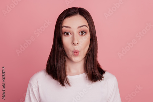 Portrait of attractive overjoyed amazed cheerful girl great news reaction isolated over pink color background