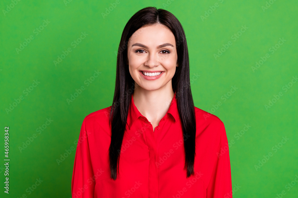 Portrait of attractive cheerful content girl wearing red casual shirt isolated over bright green color background Portrait of attractive cheerful content girl wearing red casual shirt isolated over bright green color background