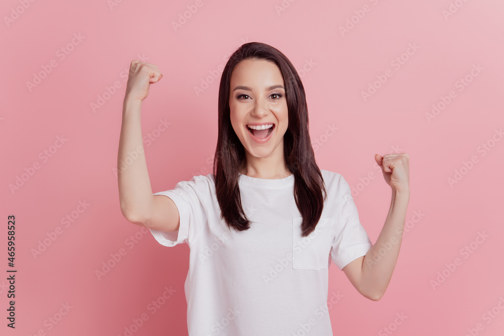 Photo of young excited girl good mood winner triumph success lucky isolated over pink color background Photo of young excited girl good mood winner triumph success lucky isolated over pink color background