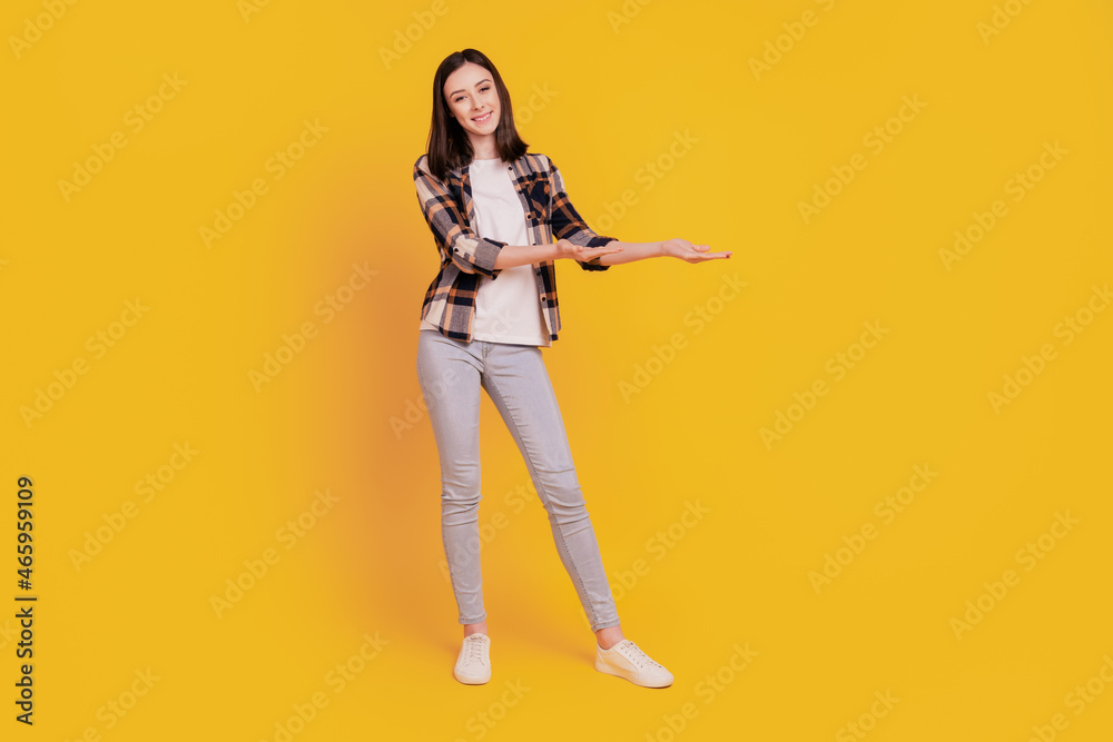 Photo of reliable lady palms demonstrate empty space variant isolated on yellow color background Photo of reliable lady palms demonstrate empty space variant isolated on yellow color background