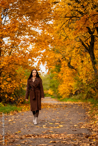 Portrait of a young woman in a brown coat in autumn © Bernhard