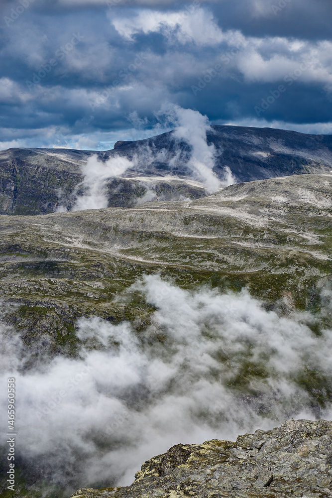 View down towards to cloud covered road that leads up to Dalsnibba, Geiranger, Norway