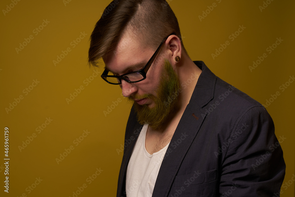 Fototapeta premium bearded man in a black jacket with a book in his hands education