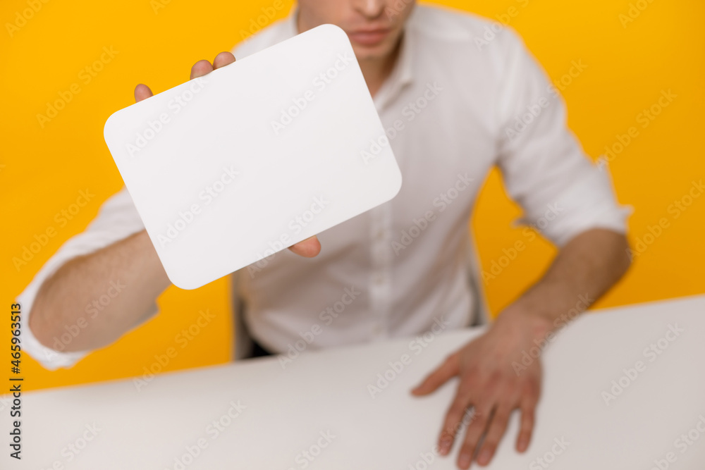 Young businessman is showing the word. Your text here
