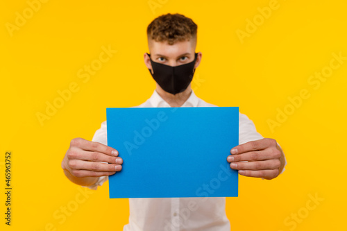 Young businessman is showing the word. Your text here