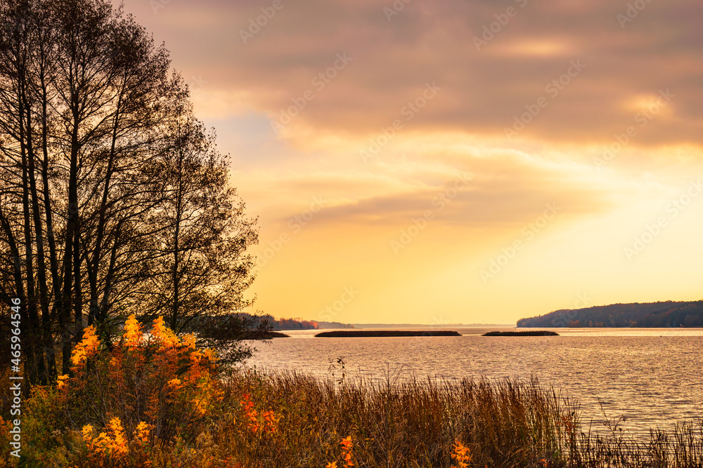 Autumn sunset landscape over the Narew River