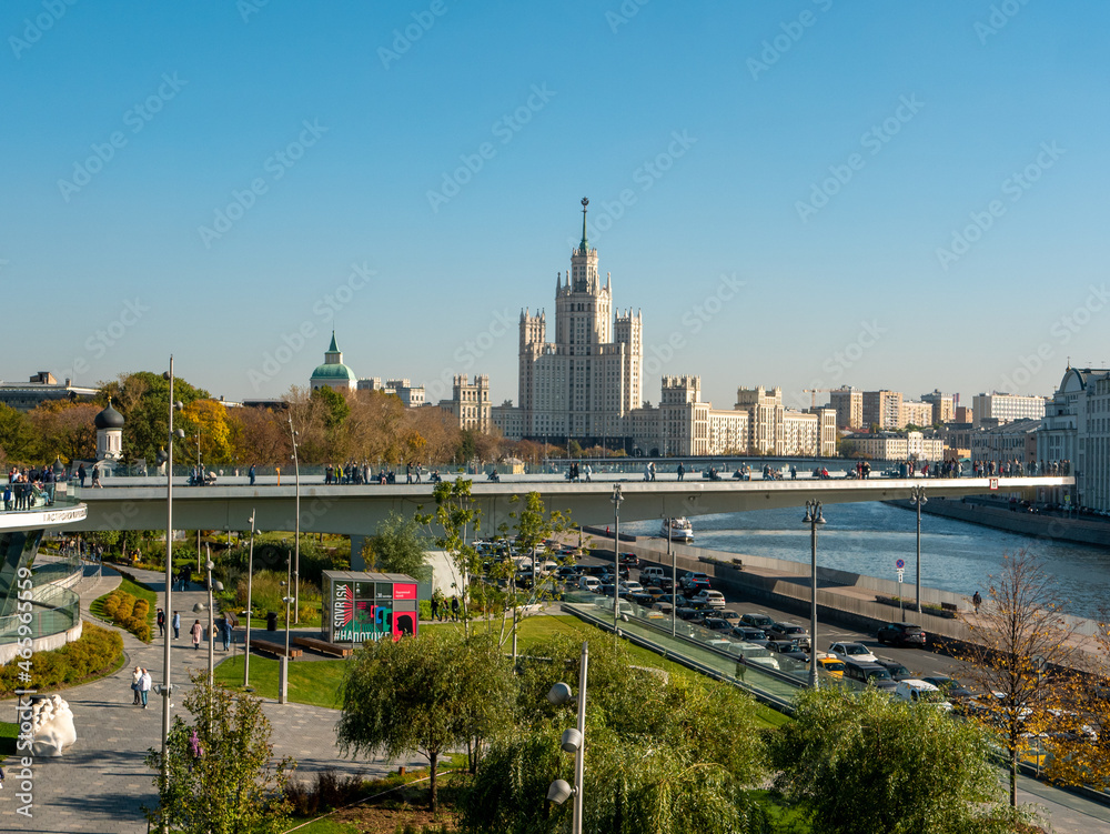 Fototapeta premium Moscow, Russia - October 5, 2021: Zaryadye Park. Floating bridge with walking people against the blue sky. Copy space