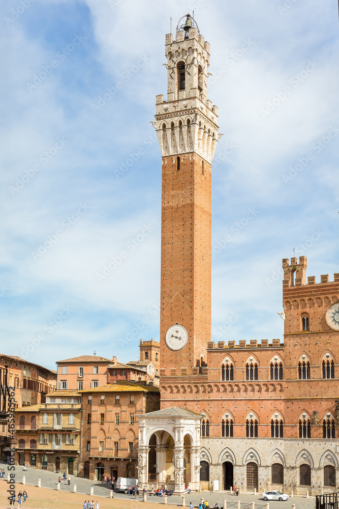 View to Palazzo Pubblico with the clock tower in Siena, Italy