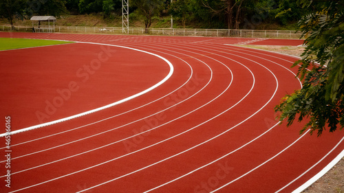 Red running track in public stadium. Sport Backgrounds.