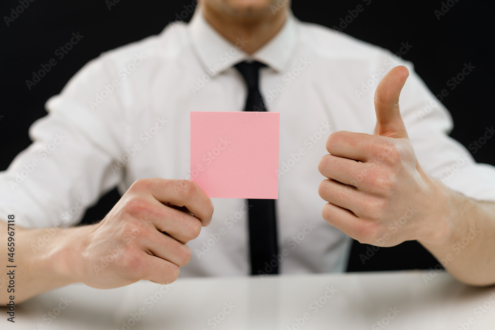 Young businessman is showing the word. Your text here