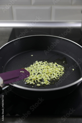 Making a sauce with olive oil, garlic