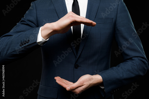 Young businessman is showing the word. Your text here