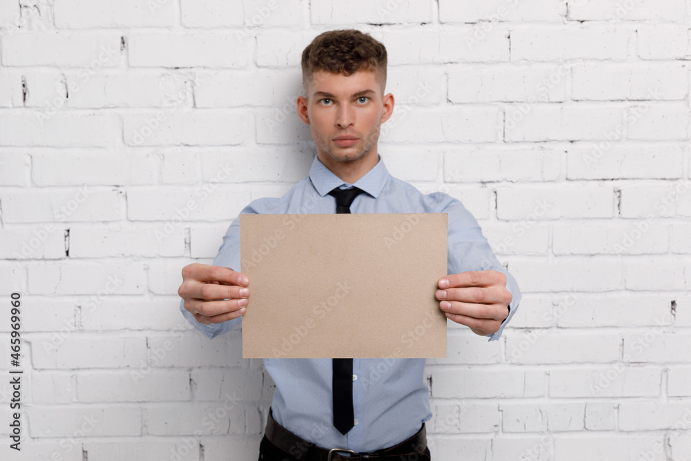 Young businessman is showing the word. Your text here Young businessman is showing the word. Your text here